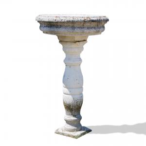 Antique stone fountain. 1800s period.